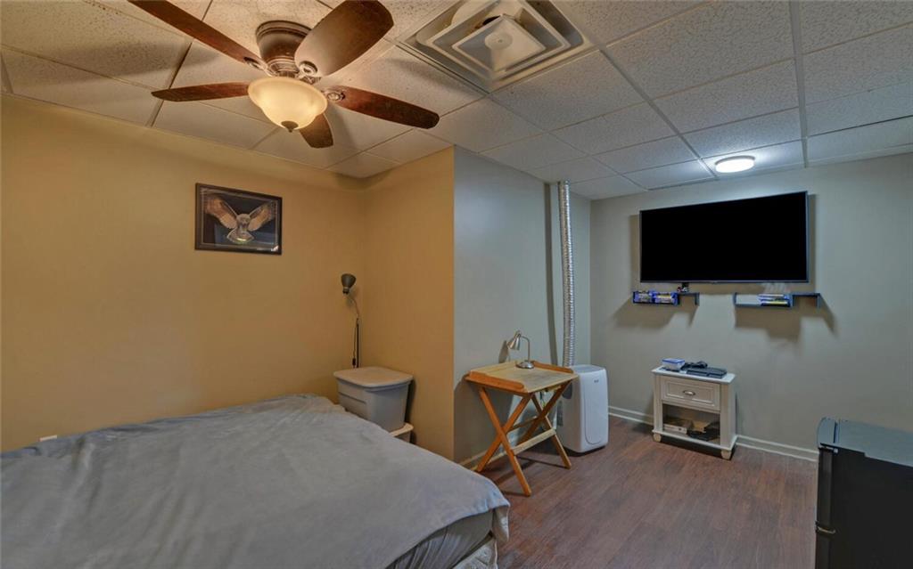 3644 Maple Forge Lane Gainesville, GA 30504 - Photo 27 of 49 a bedroom with bed and tv