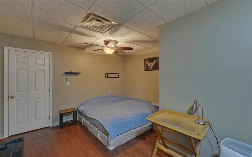 3644 Maple Forge Lane Gainesville, GA 30504 - Photo 28 of 49 a bedroom with a bed and a table