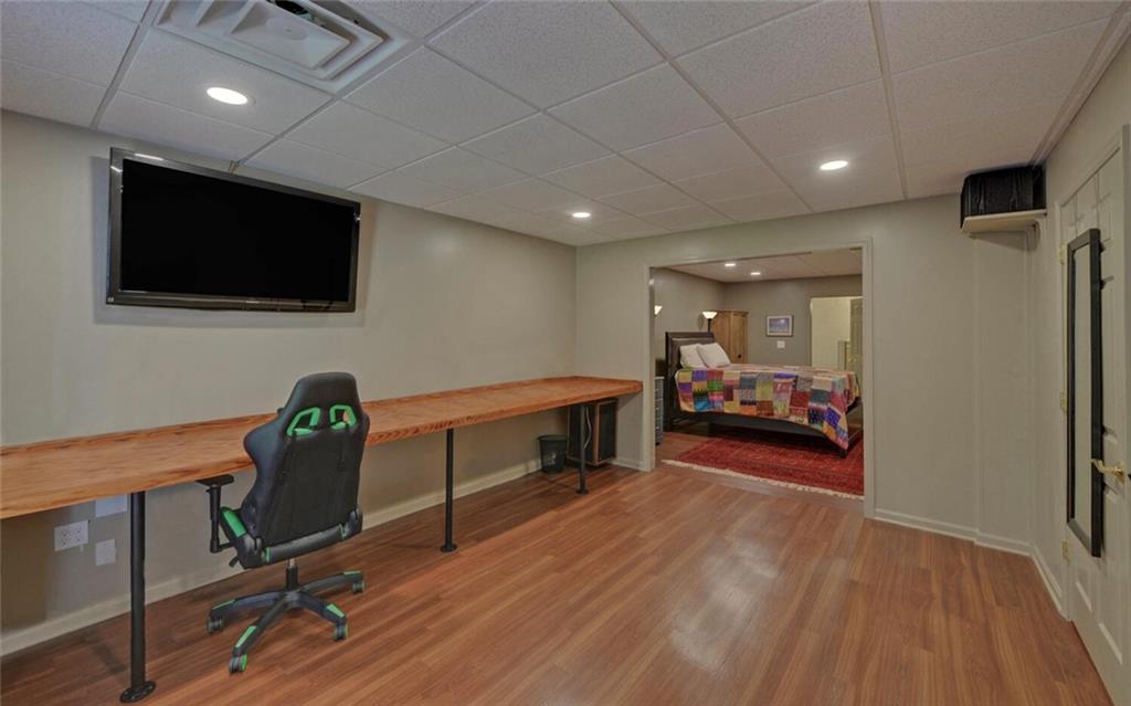3644 Maple Forge Lane Gainesville, GA 30504 - Photo 30 of 49 a view of a livingroom with furniture and a flat screen tv