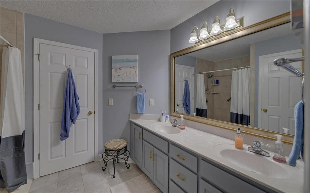 3644 Maple Forge Lane Gainesville, GA 30504 - Photo 43 of 49 a bathroom with a double vanity sink and a mirror