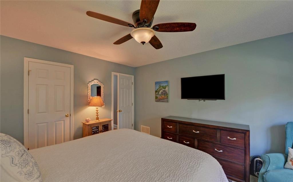 3644 Maple Forge Lane Gainesville, GA 30504 - Photo 5 of 49 a bedroom with a bed and a flat screen tv