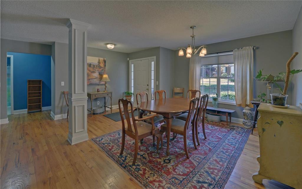 3644 Maple Forge Lane Gainesville, GA 30504 - Photo 8 of 49 a view of a dining room with furniture window and wooden floor