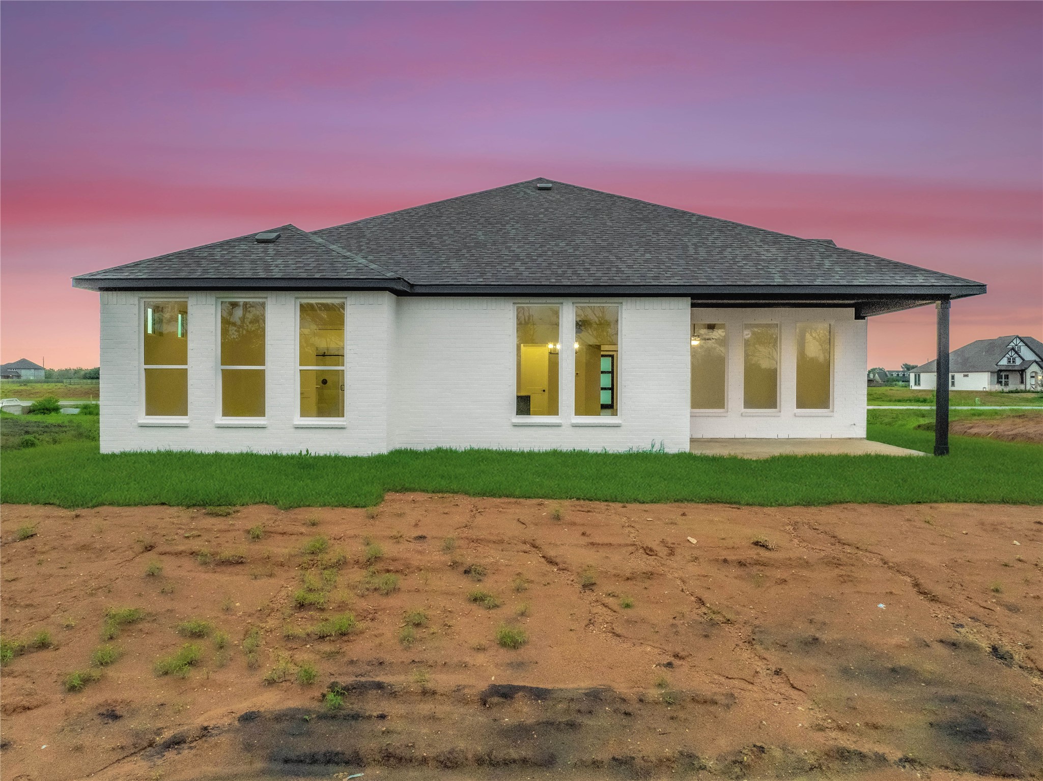 4610 Magnolia Bend Drive Rosharon, TX 77583 - Photo 39 of 48 a front view of a house with a yard and garage