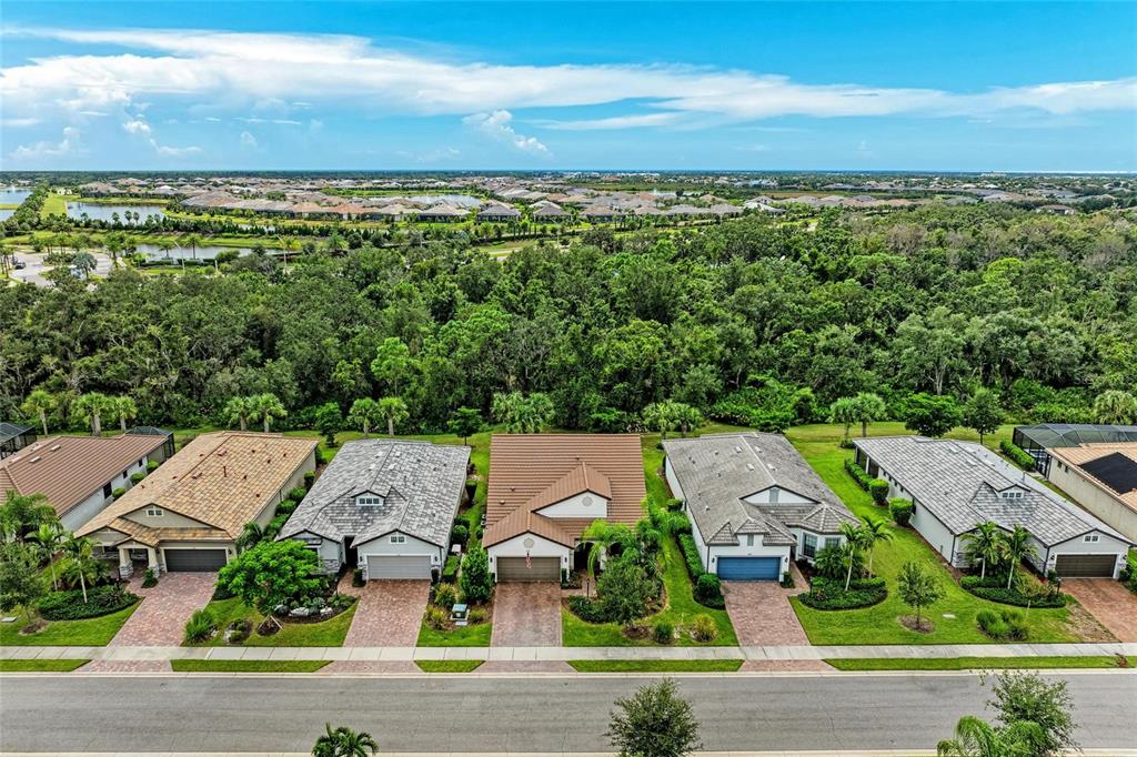 7572 Viola Loop Bradenton, FL 34202 - Photo 3 of 65 an aerial view of residential houses with outdoor space and street view