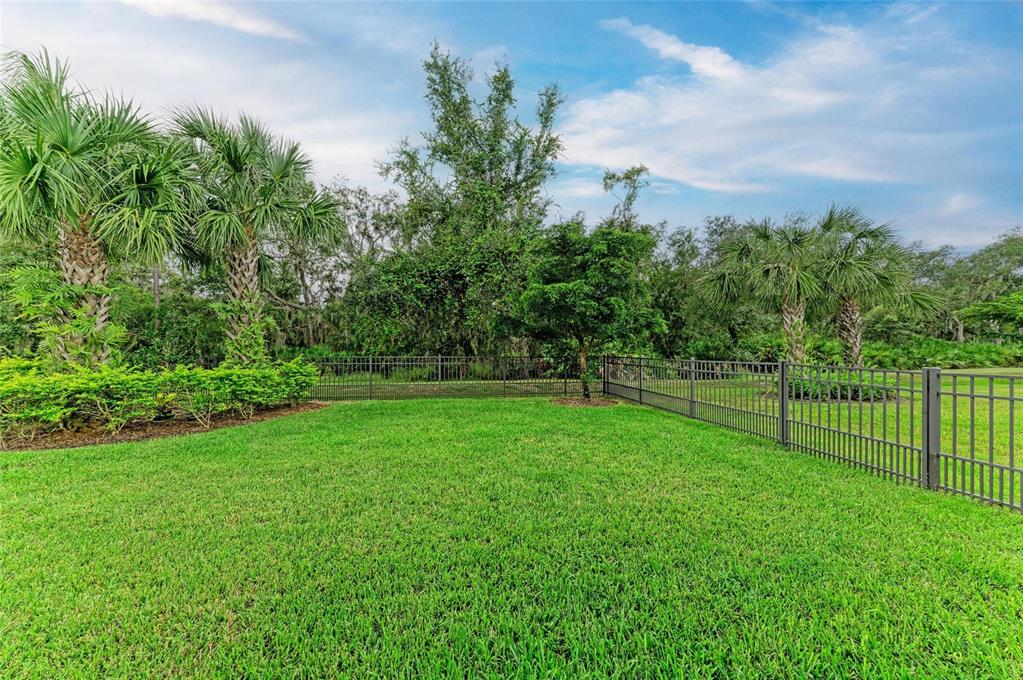 7572 Viola Loop Bradenton, FL 34202 - Photo 46 of 65 a view of an outdoor space and a yard