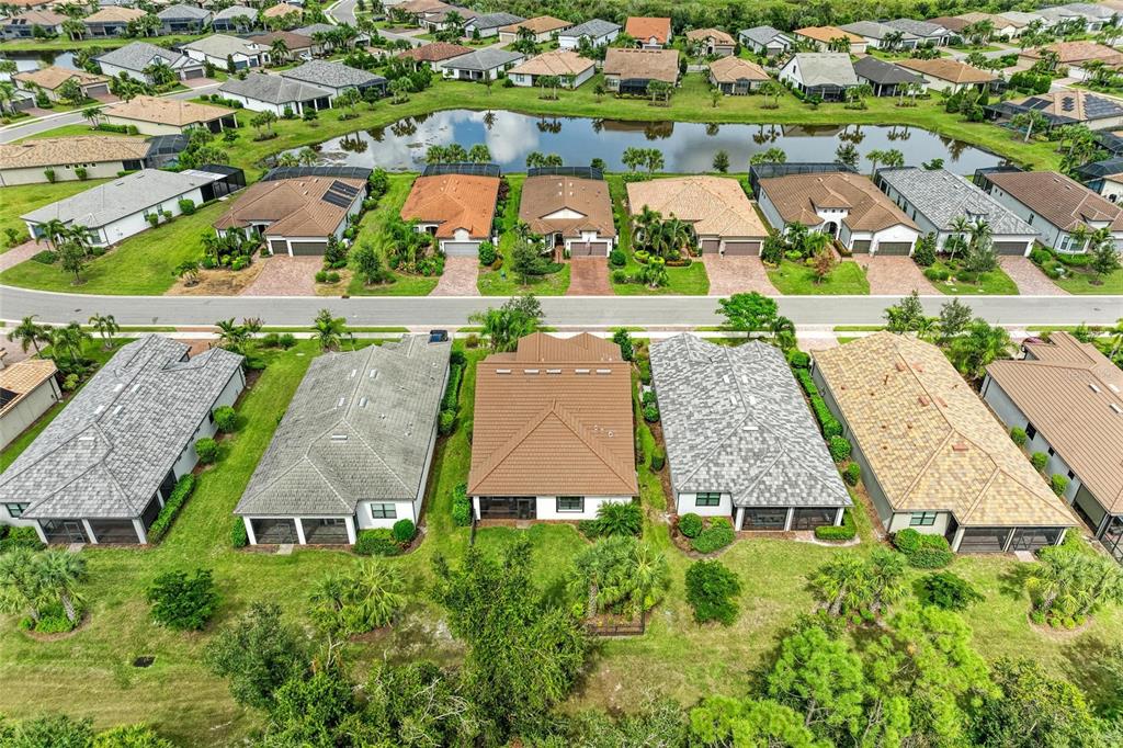 7572 Viola Loop Bradenton, FL 34202 - Photo 48 of 65 an aerial view of residential houses with outdoor space and street view