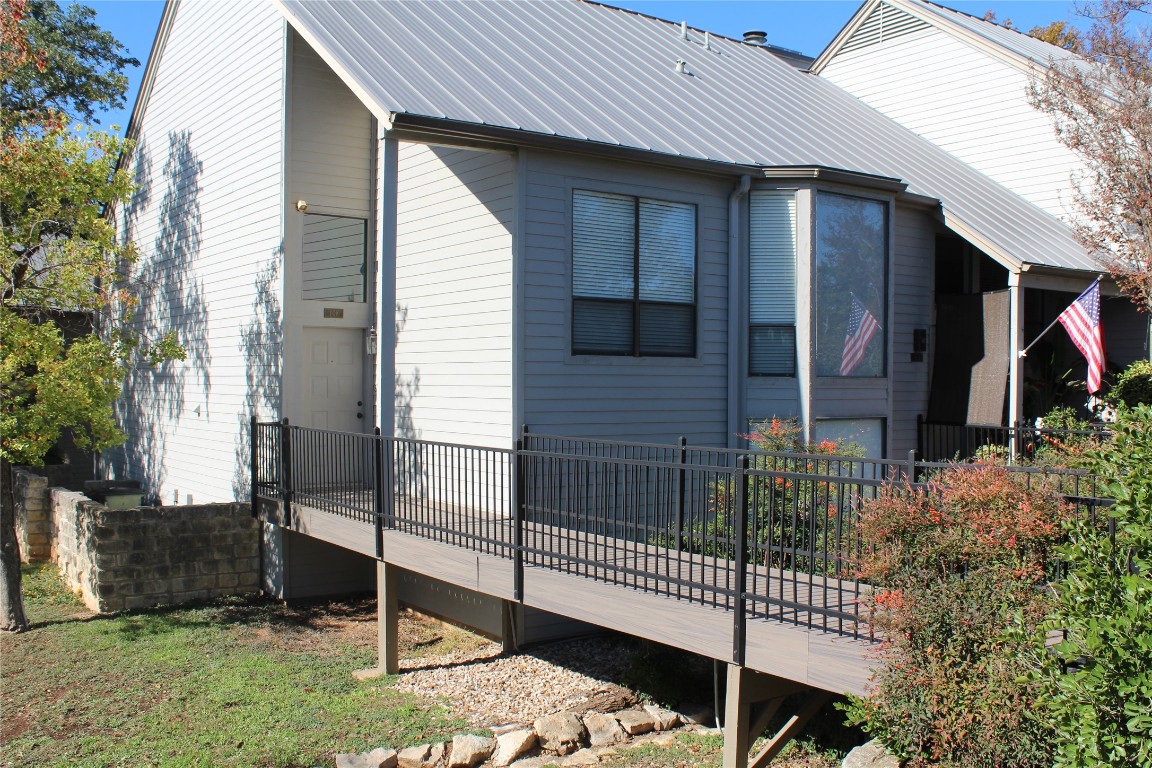108 World Of Tennis Square, Unit 108C Lakeway, TX 78738 - Photo 1 of 25 a front view of a house having yard