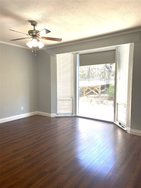 108 World Of Tennis Square, Unit 108C Lakeway, TX 78738 - Photo 15 of 25 a view of an empty room with wooden floor and a window
