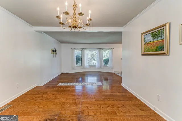 a kitchen with stainless steel appliances granite countertop a sink and wooden cabinets