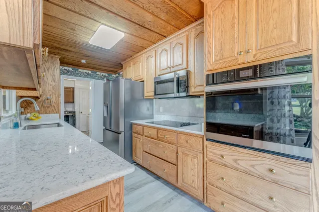 a view of a kitchen with a refrigerator