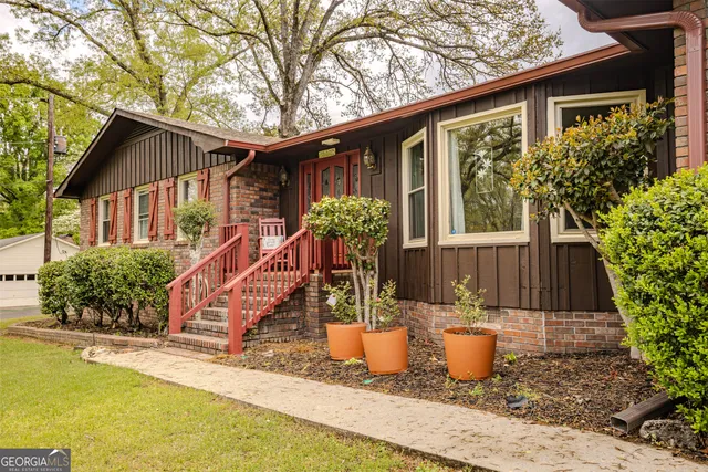 a front view of a house with garden