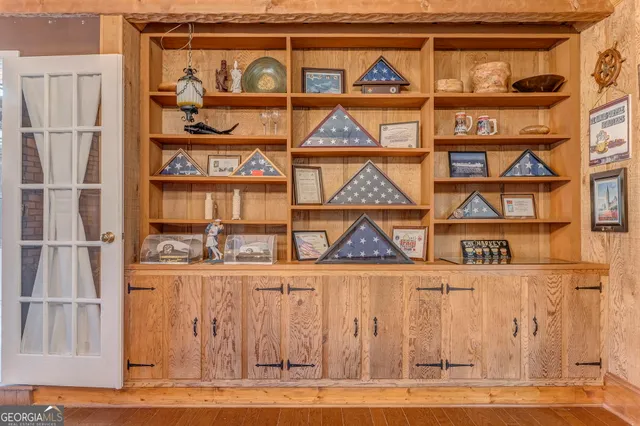 a bathroom with a sink a toilet and shower curtain