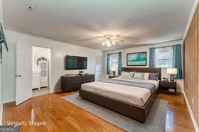 a view of a room with a bed and a window