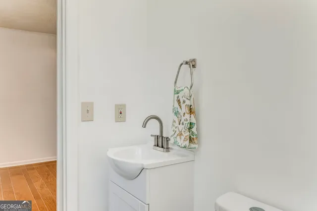 a view of an empty room with a brick wall