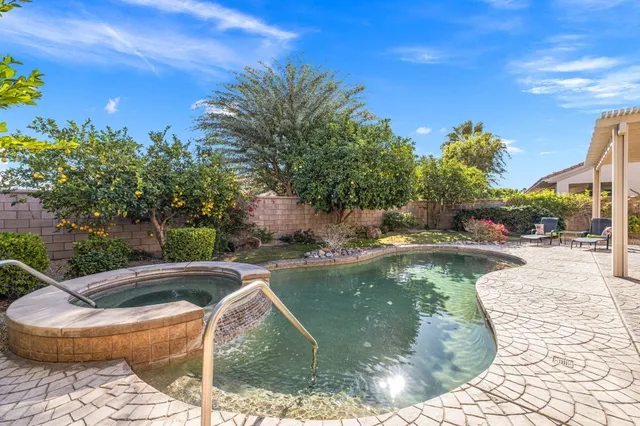 a view of a swimming pool with a patio