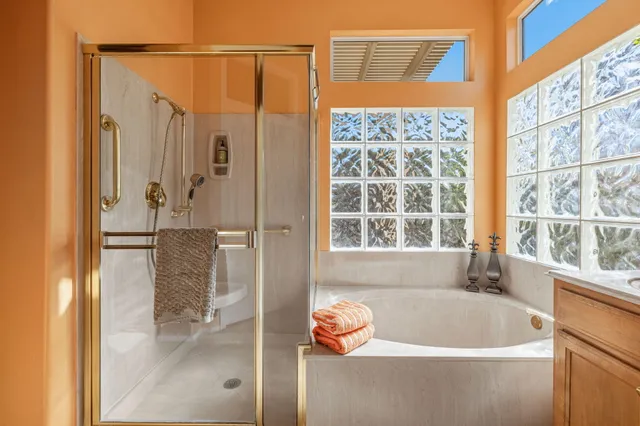 a bath tub sitting next to a window