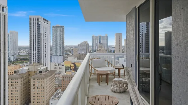 a view of a balcony with chair and table in the balcony