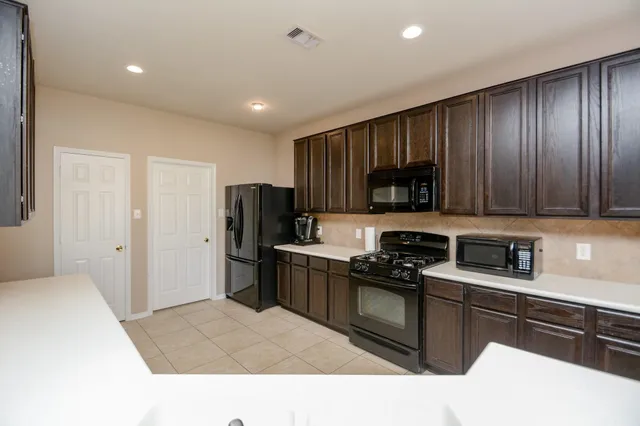 a white toilet sitting next to a shower curtain