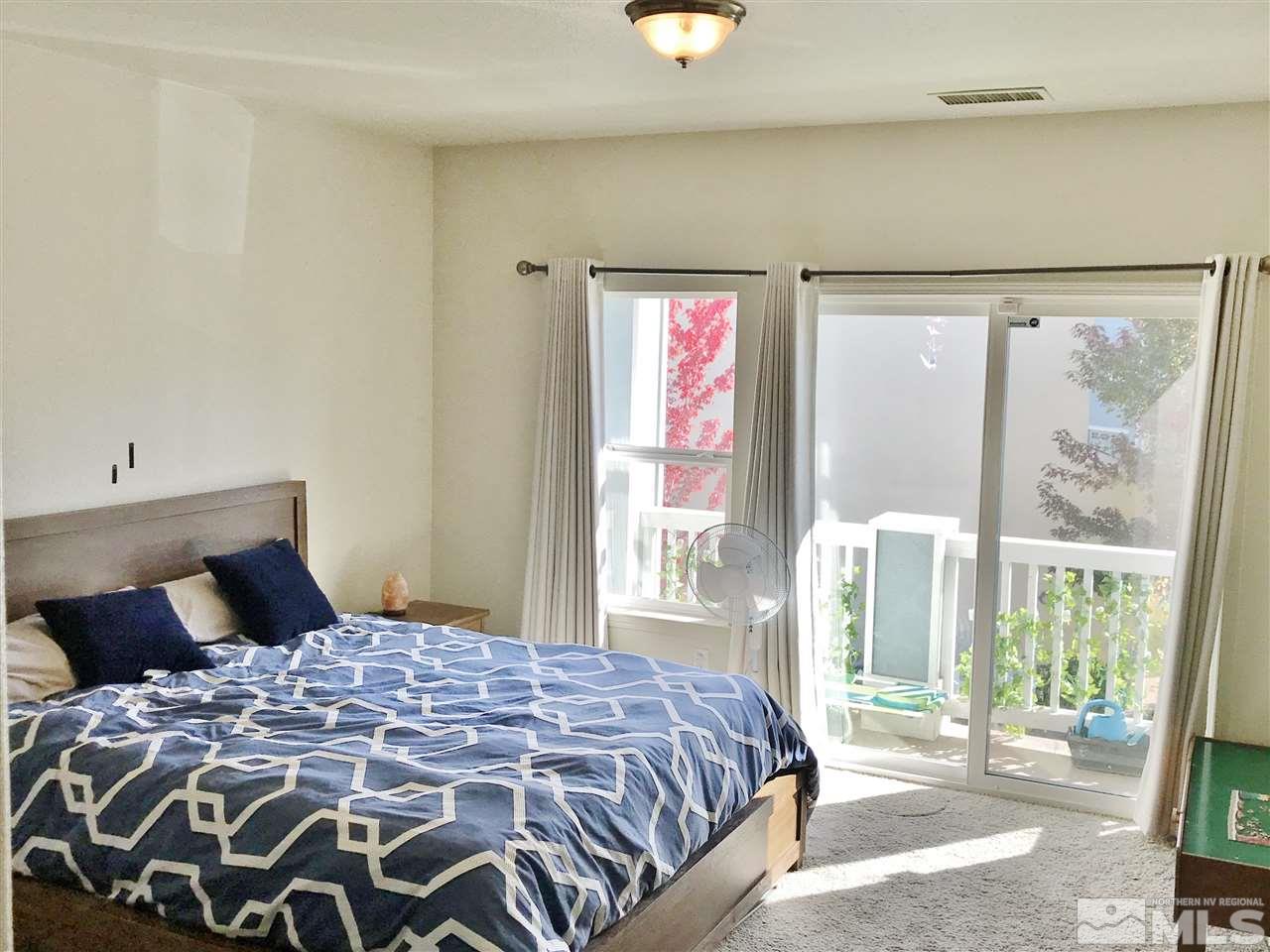 260 Brenham Avenue Reno, NV 89509 - Photo 11 of 20 a bedroom with a large bed and a large window