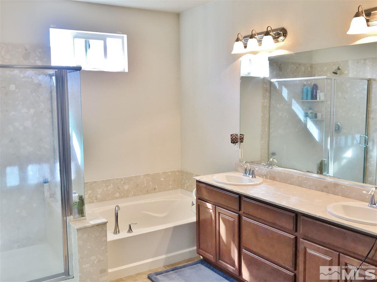 260 Brenham Avenue Reno, NV 89509 - Photo 12 of 20 a bathroom with a tub sink and mirror