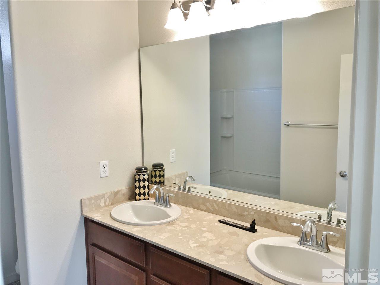 260 Brenham Avenue Reno, NV 89509 - Photo 15 of 20 a bathroom with a granite countertop sink and a mirror