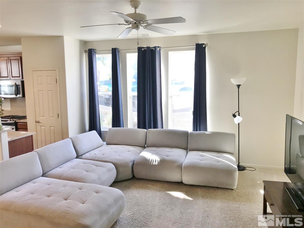 260 Brenham Avenue Reno, NV 89509 - Photo 7 of 20 a living room with furniture and a flat screen tv