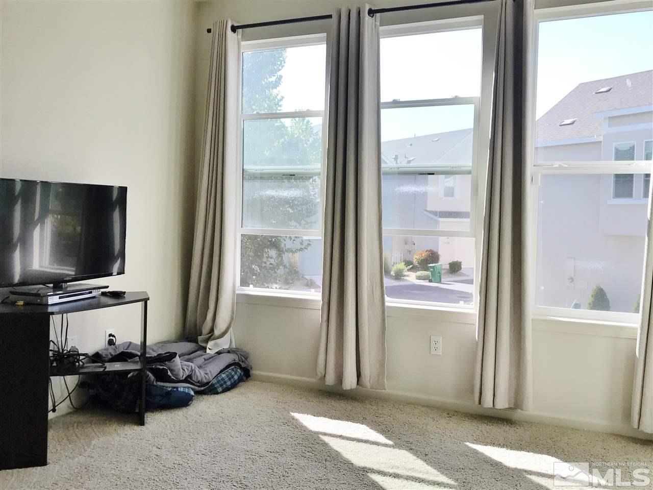 260 Brenham Avenue Reno, NV 89509 - Photo 10 of 20 a living room with furniture and a flat screen tv