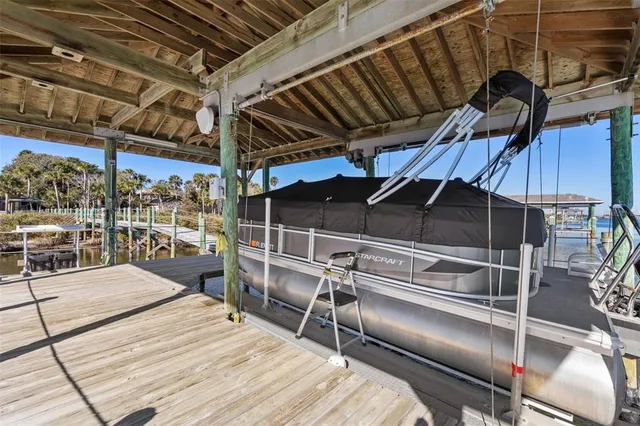a view of a balcony with wooden floor and outdoor space