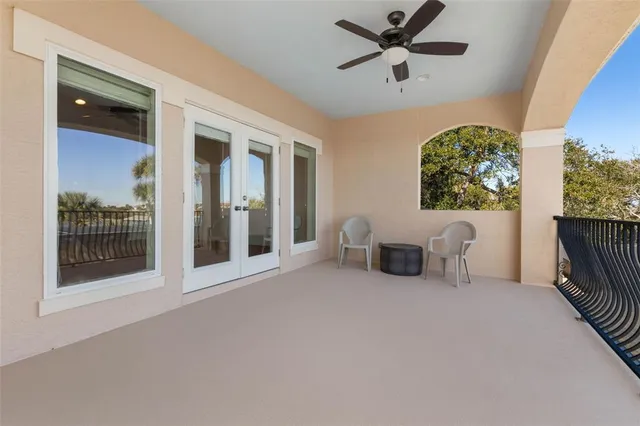 a view of a patio with a dining table and chairs