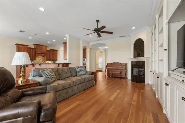 a kitchen with kitchen island granite countertop a stove refrigerator and cabinets
