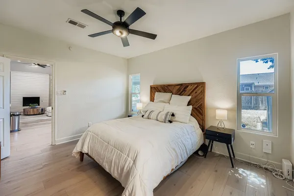 a bedroom with a bed and a window