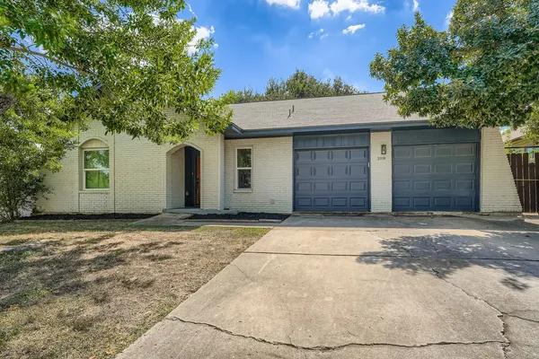 a front view of a house with a garage