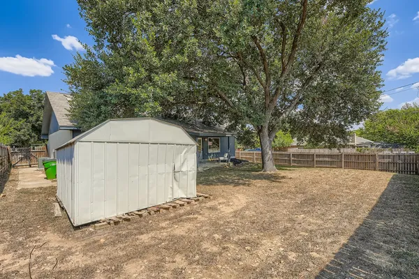 a view of outdoor space with wooden fence