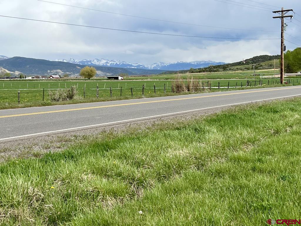 Tract 2 Government Springs Road Montrose, CO 81403 - Photo 7 of 9 a view of green field with house in the background