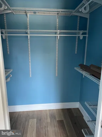 a kitchen with stainless steel appliances a refrigerator and microwave