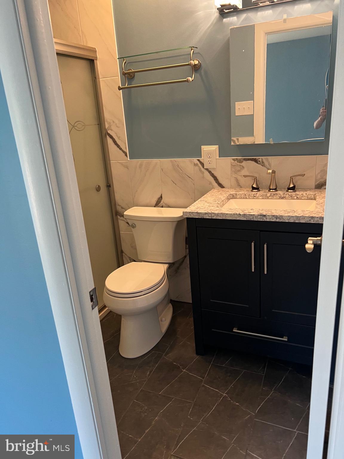 700 Ardmore Ave Ardmore Avenue, Unit 606 Ardmore, PA 19003 - Photo 24 of 32 a bathroom with a sink and a mirror