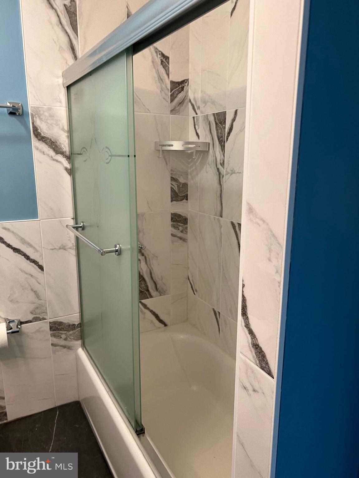 700 Ardmore Ave Ardmore Avenue, Unit 606 Ardmore, PA 19003 - Photo 30 of 32 a bathroom with a bathtub and a shower