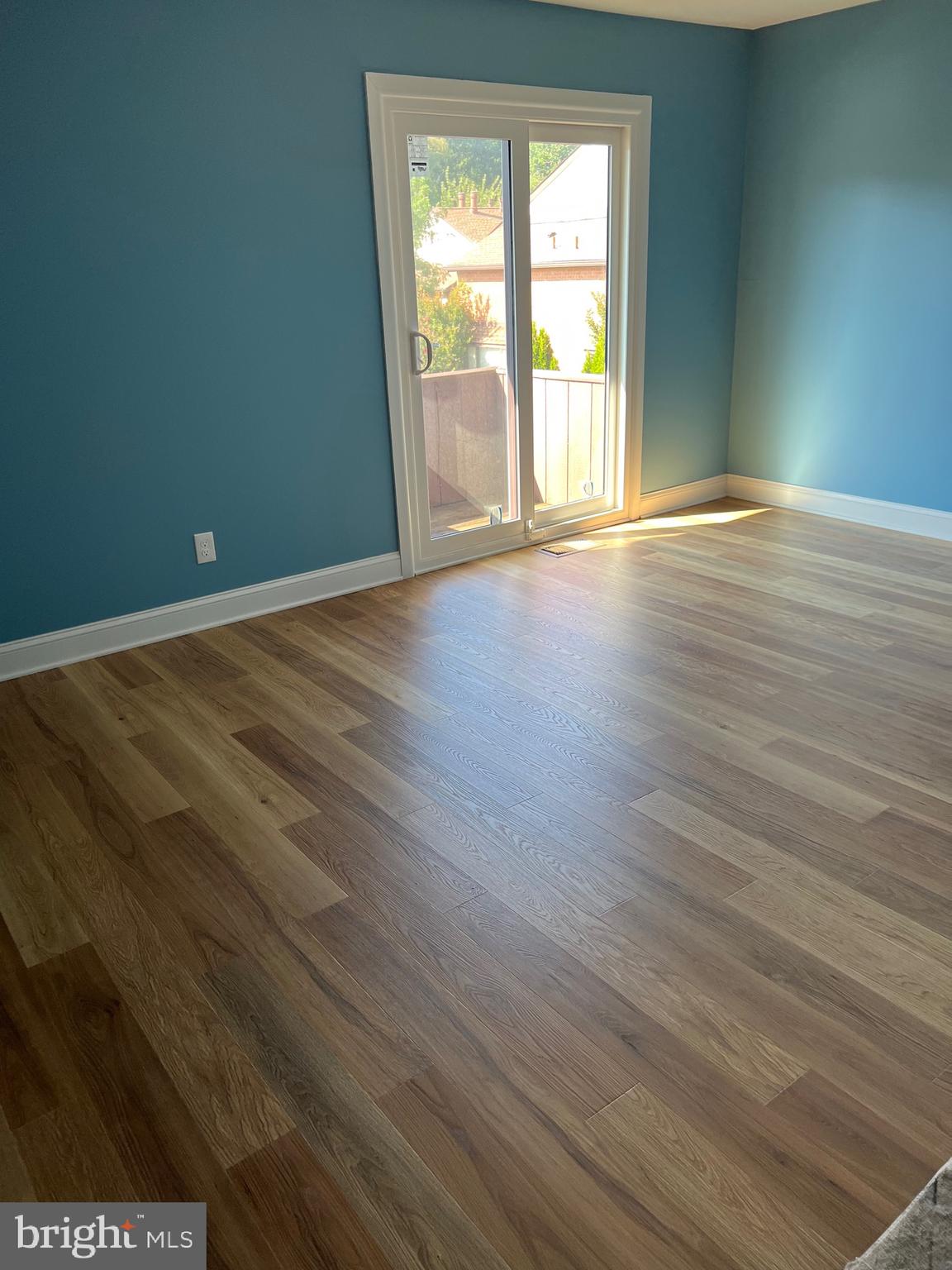 700 Ardmore Ave Ardmore Avenue, Unit 606 Ardmore, PA 19003 - Photo 32 of 32 a view of an empty room with wooden floor and a window