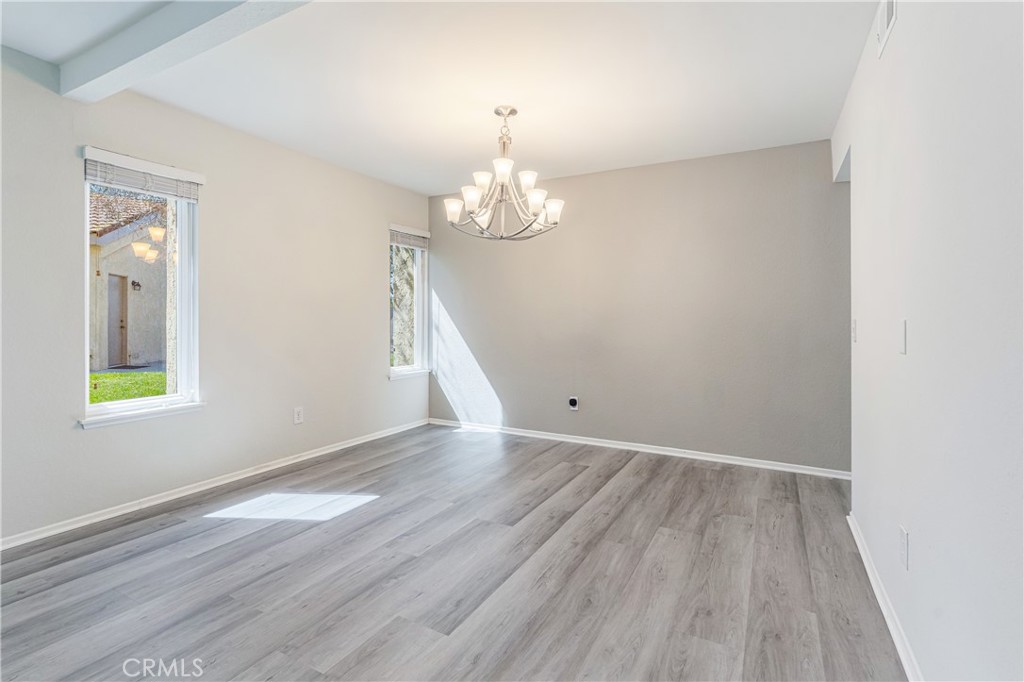 7088 Seville Way Riverside, CA 92506 - Photo 16 of 75 wooden floor in an empty room with a window