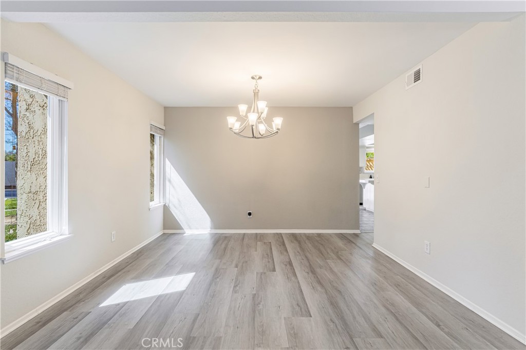 7088 Seville Way Riverside, CA 92506 - Photo 17 of 75 a view of empty room with wooden floor