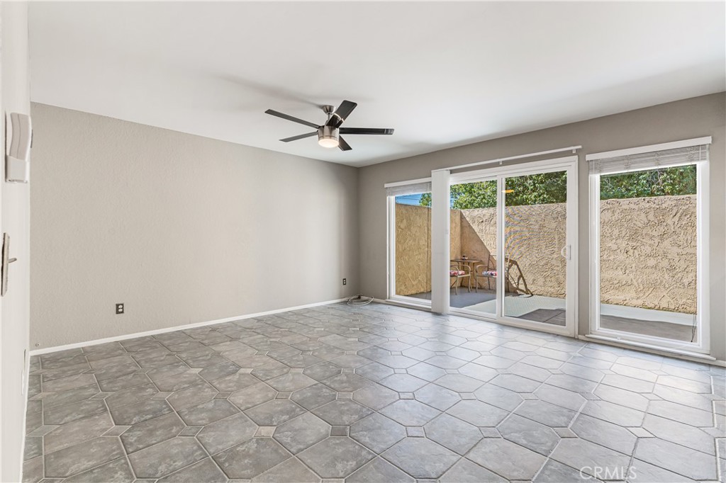 7088 Seville Way Riverside, CA 92506 - Photo 21 of 75 a view of an empty room with a window