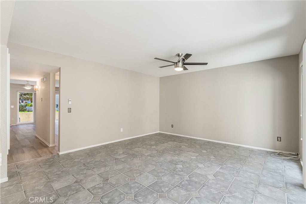 7088 Seville Way Riverside, CA 92506 - Photo 29 of 75 a view of a room with a ceiling fan and carpet