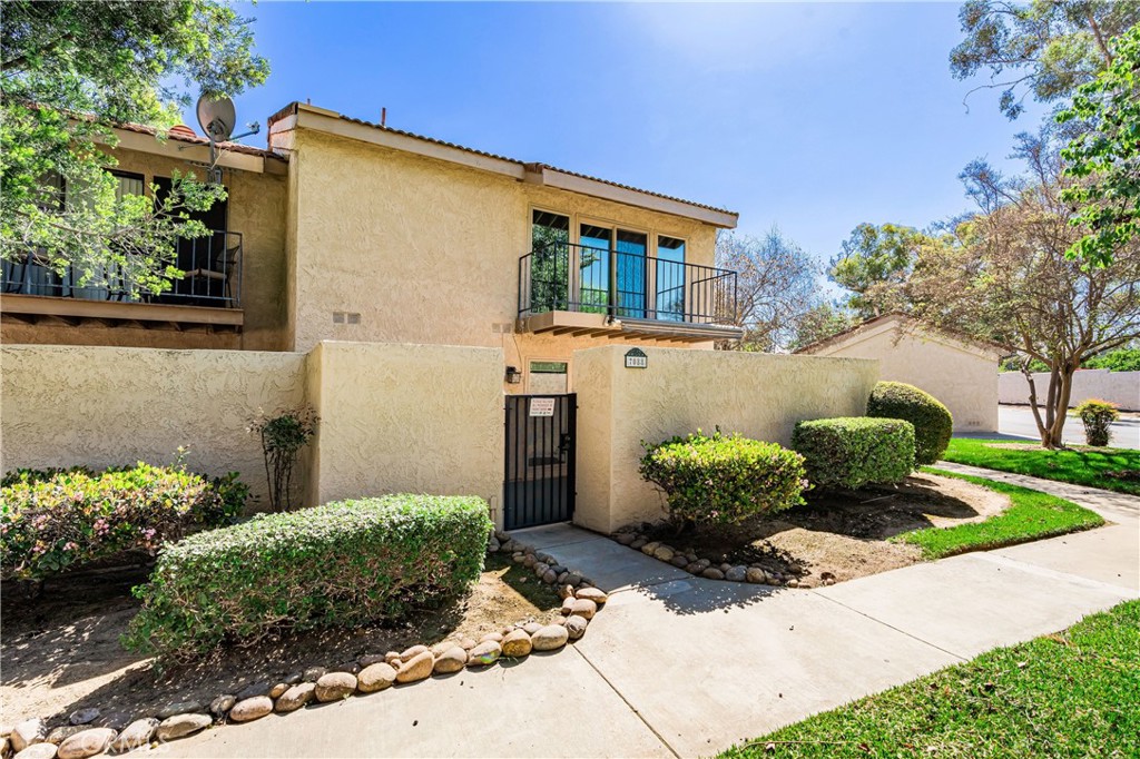 7088 Seville Way Riverside, CA 92506 - Photo 3 of 75 a front view of a house with a yard