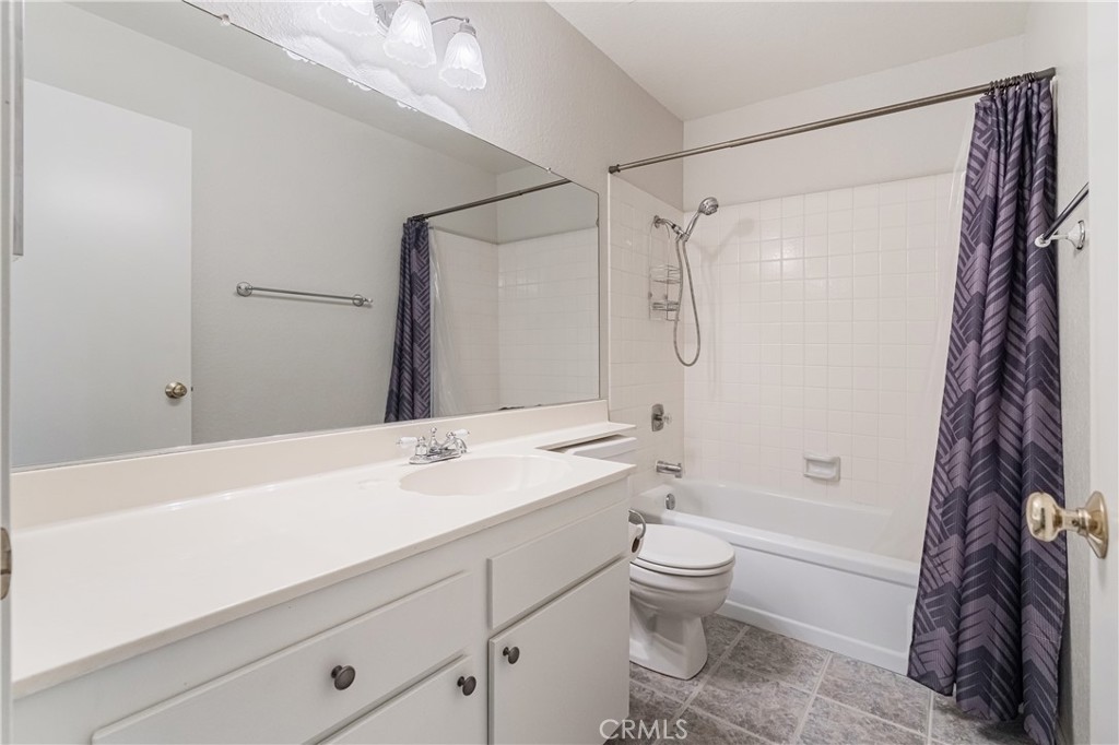 7088 Seville Way Riverside, CA 92506 - Photo 41 of 75 a bathroom with a sink a toilet and shower