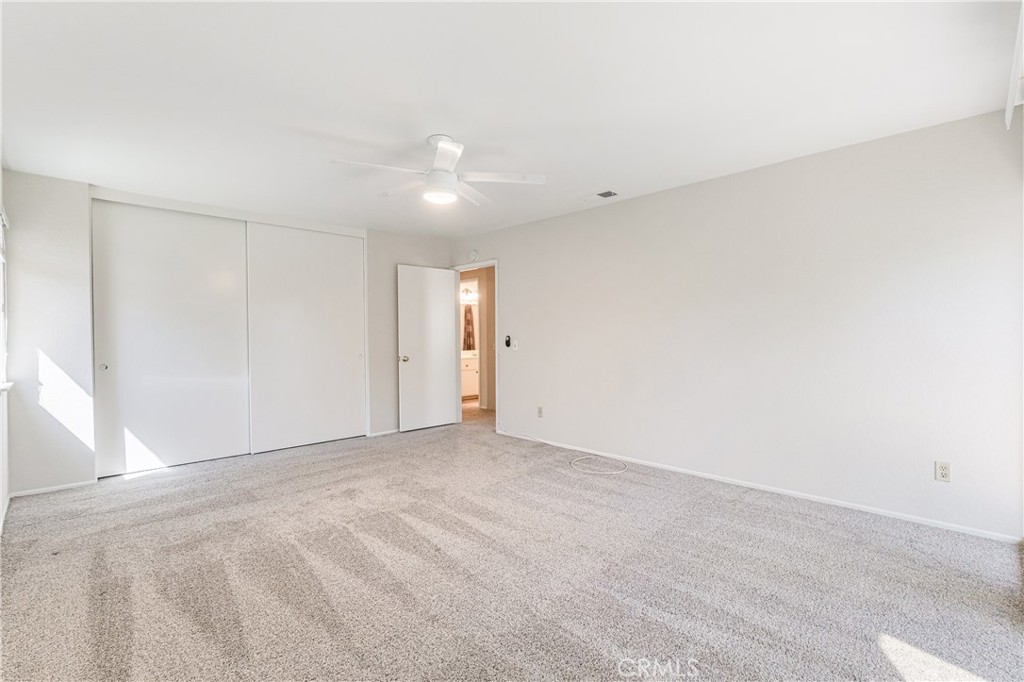 7088 Seville Way Riverside, CA 92506 - Photo 44 of 75 an empty room with an entryway
