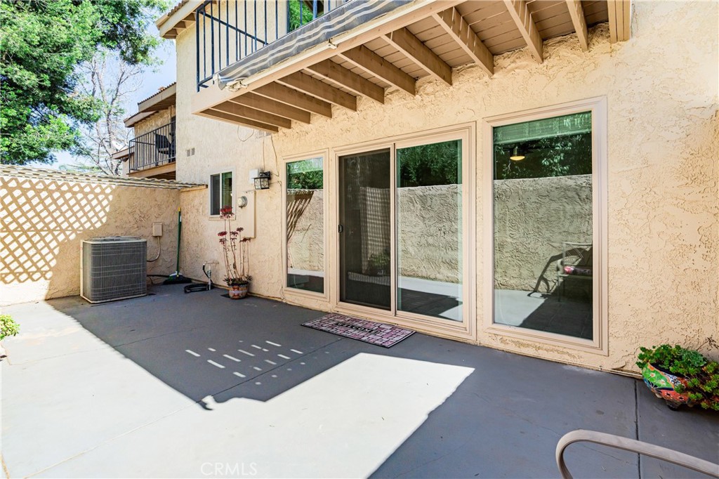 7088 Seville Way Riverside, CA 92506 - Photo 58 of 75 a view of a patio with table and chairs and potted plants