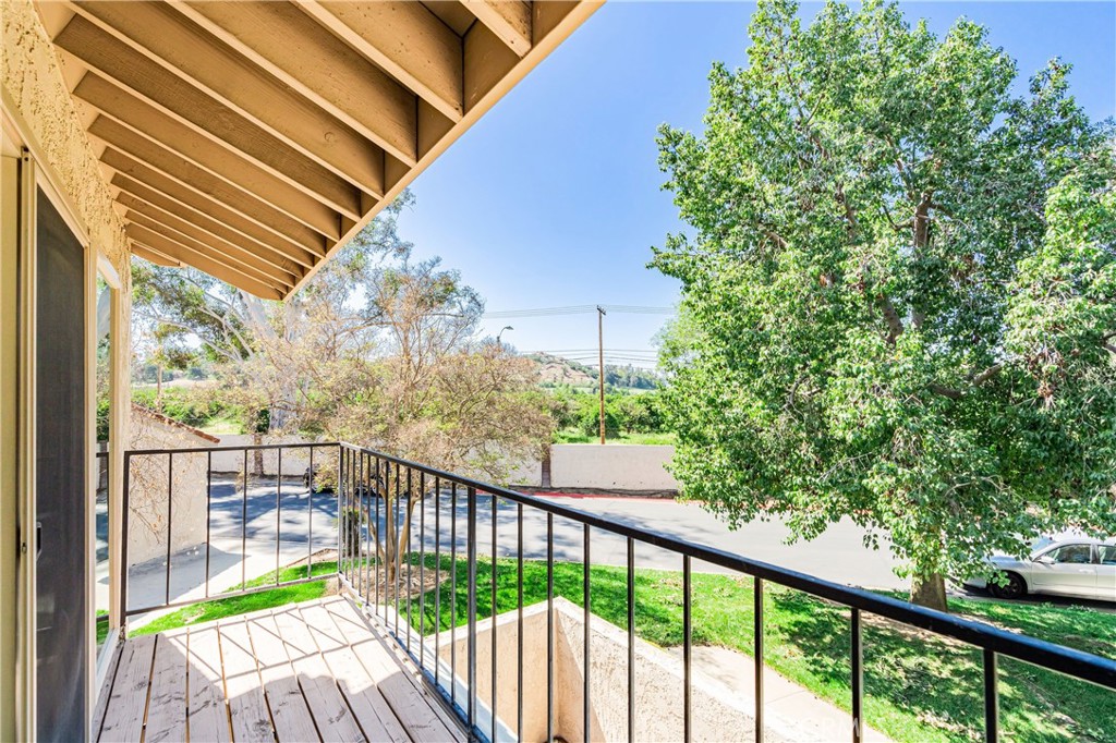 7088 Seville Way Riverside, CA 92506 - Photo 62 of 75 a view of a balcony with wooden floor