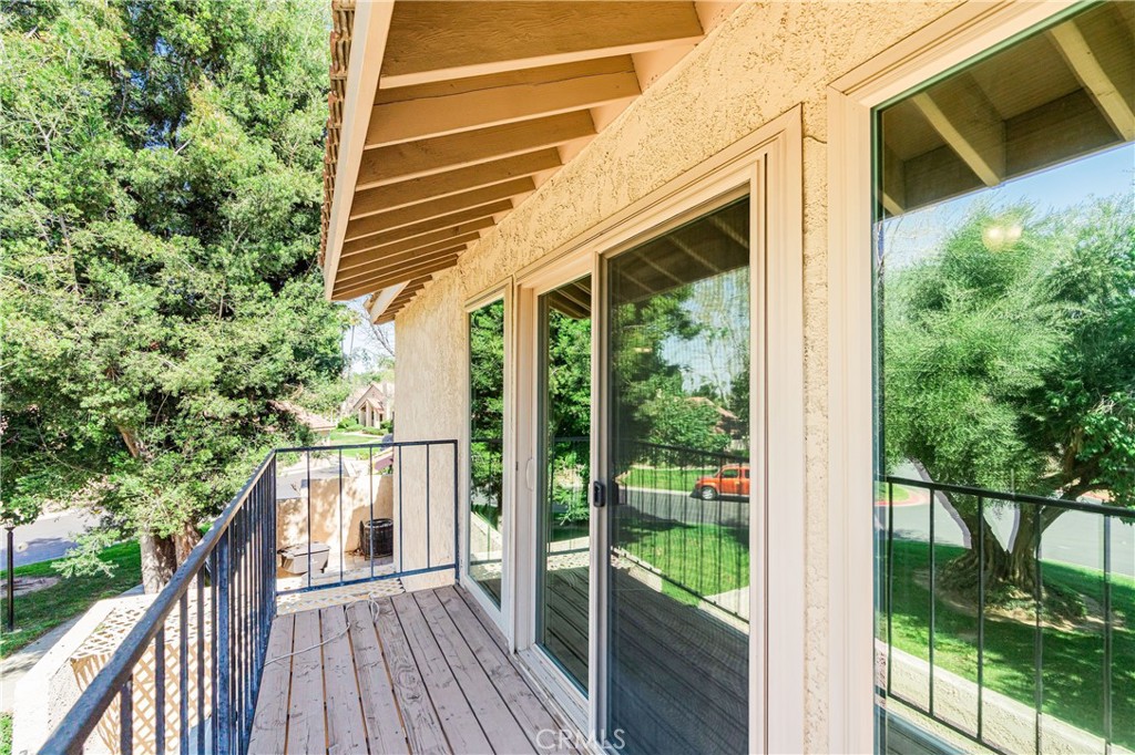 7088 Seville Way Riverside, CA 92506 - Photo 64 of 75 a view of a house with backyard and wooden floor