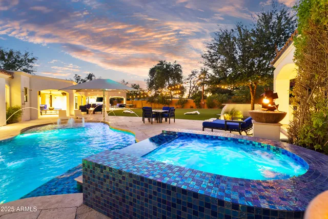 a view of a swimming pool with lounge chairs