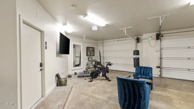 a view of hallway with furniture and a window